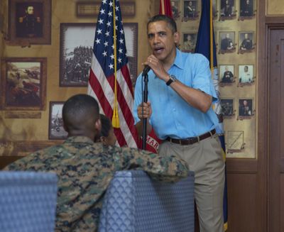 President Barack Obama speaks with members of the military and their families at Marine Corps Base Hawaii on Tuesday. (Associated Press)