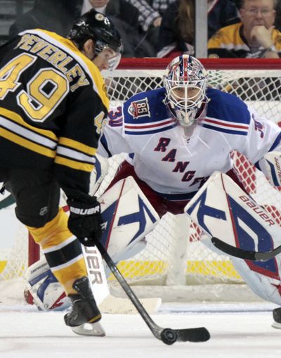 Rangers goalie Henrik Lundqvist readies to stop a shot by Bruins’ Rich Peverley in third period of New York’s 1-0 victory Saturday. (Associated Press)