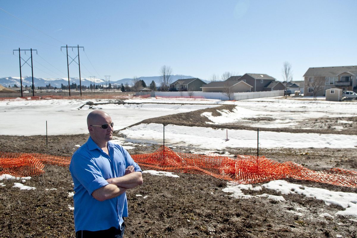 Spokane Valley resident David Klenda is photographed behind his neighborhood on Tuesday, March 19, 2019. Has lived in the neighborhood for more than a decade, had flooding in his backyard three times in the first five years. He