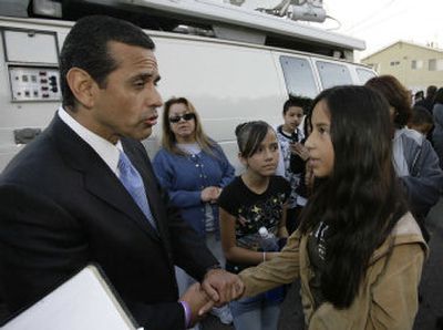 
Joana Ponce, 12, talks with Los Angeles Mayor Antonio Villaraigosa during a news conference last week  in Wilmington, Calif. Her uncle, Arturo Ponce, was slain in December. 
 (Associated Press / The Spokesman-Review)