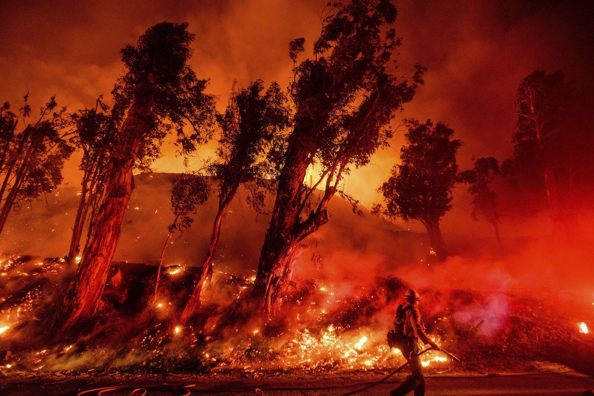 In this Nov. 1, 2019, photo, flames from a backfire consume a hillside as firefighters battle the Maria Fire in Santa Paula, Calif. The decade that just ended was by far the hottest ever measured on Earth, capped off by the second-warmest year on record, NASA and the National Oceanic and Atmospheric Administration reported Wednesday, Jan. 15, 2020. (Noah Berger / Associated Press)