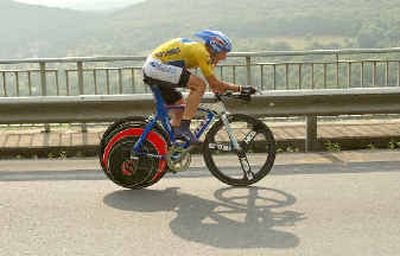 
Leader Lance Armstrong breaks from the pack to win Saturday's 34.18-mile time trial near Besancon, France. 
 (Associated Press / The Spokesman-Review)
