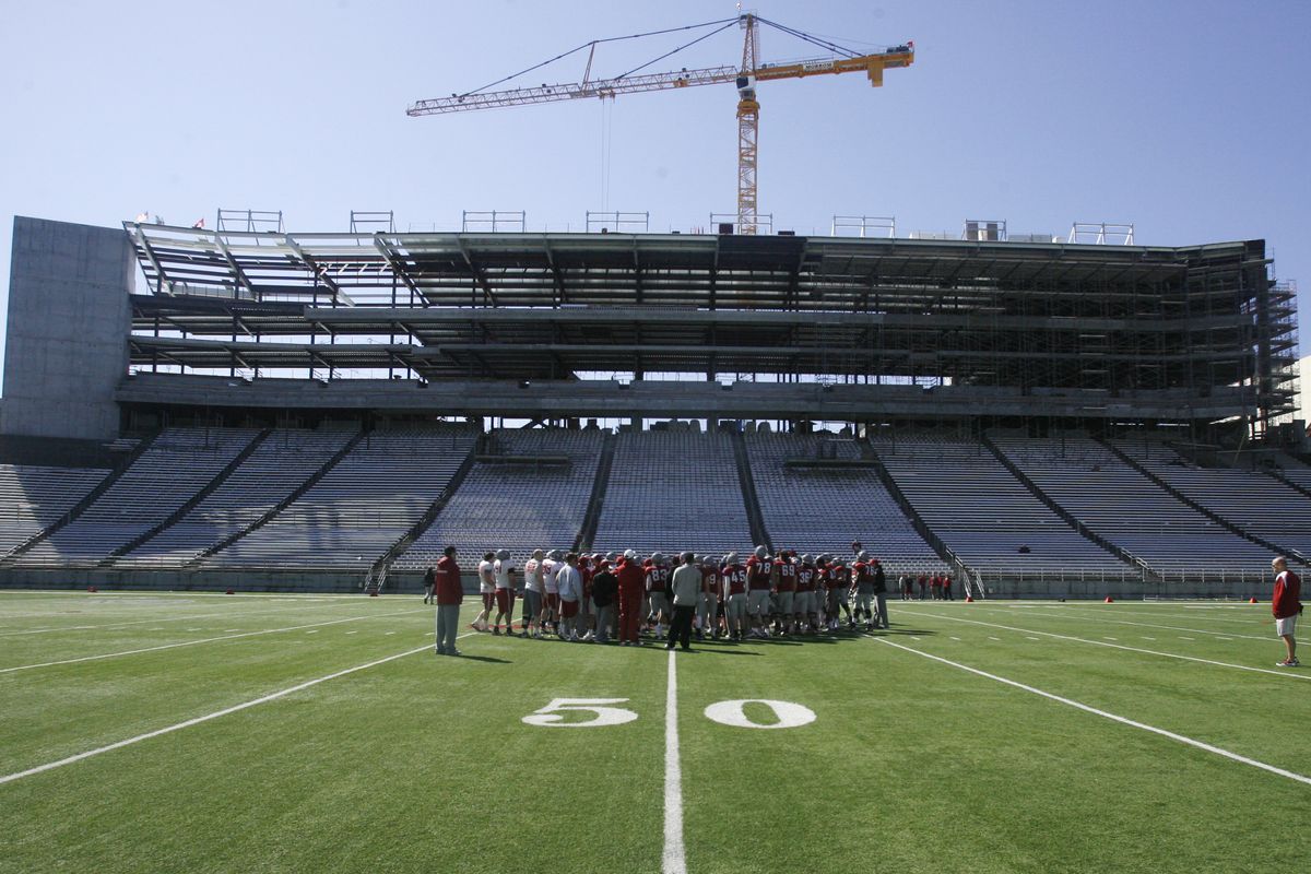 The Cougars huddle together at the center of their field after Saturday’s extensive scrimmage. (Alicia Carlson photos)