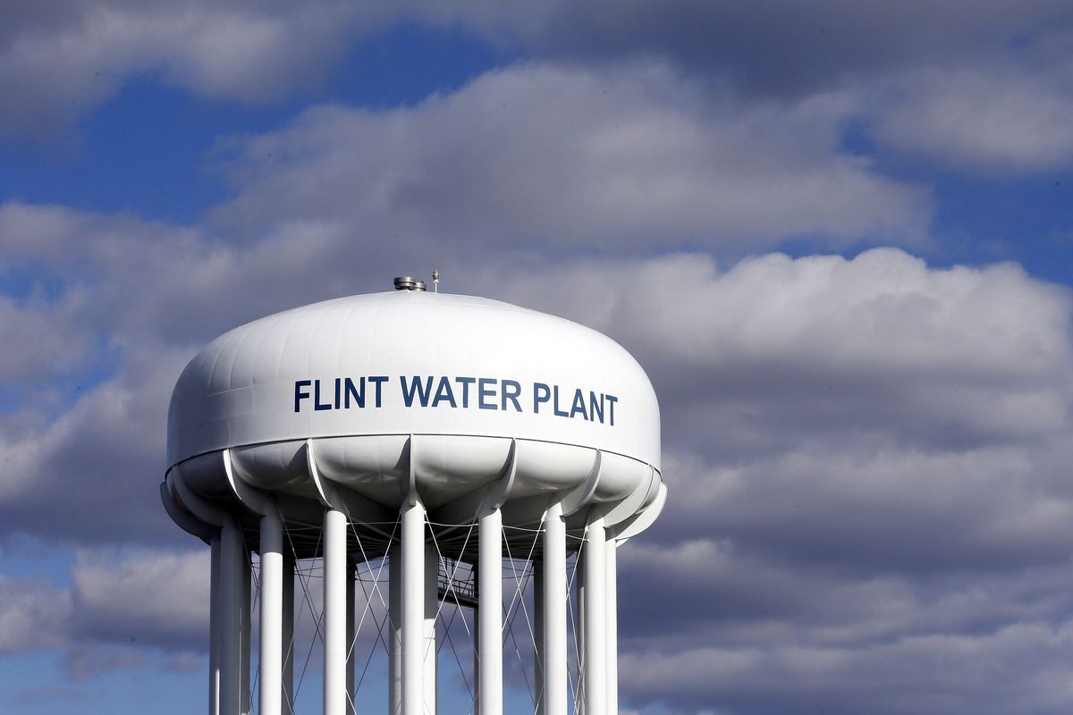 FILE - In this March 21, 2016, file photo, the Flint Water Plant water tower is seen in Flint, Mich. Former Michigan Gov. Rick Snyder, Nick Lyon, former director of the Michigan Department of Health and Human Services, and other ex-officials have been told they