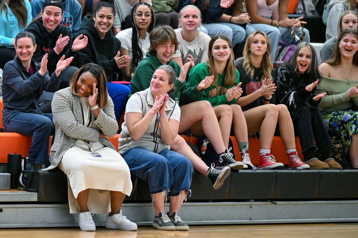 West Valley High School teacher and adviser Shanté Payne, front left, realizes she is center of attention at a school assembly to honor her with the Northeast Regional Adviser of the Year and West Valley School District Above and Beyond awards on Monday in Spokane Valley.  (DAN PELLE/THE SPOKESMAN-REVIEW)