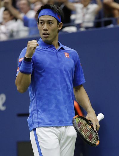 Kei Nishikori, of Japan, reacts after a point against Andy Murray, of the United Kingdom, during the quarterfinals of the U.S. Open tennis tournament. (Julio Cortez / Associated Press)