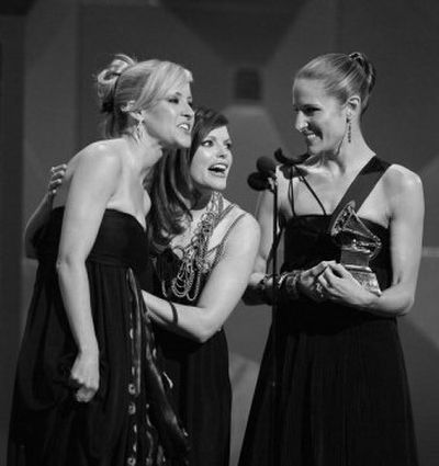
The Dixie Chicks, from left, Martie Maguire, Natalie Maines and Emily Robison, accept the award for best country album Sunday.
 (Associated Press / The Spokesman-Review)