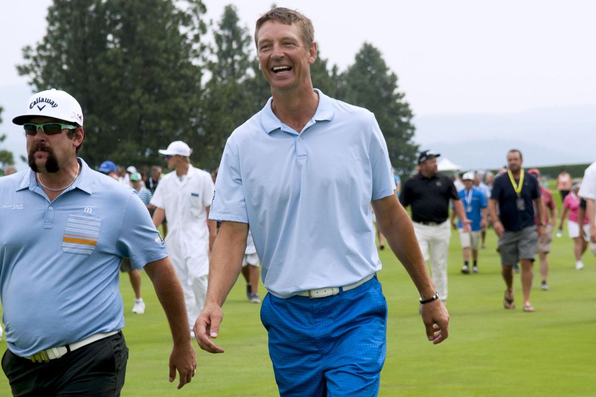 Former Sonics basketball great Detlef Schrempf, center, walks with pro golfer Andres Gonzales during the Showcase Golf event to benefit Community Cancer Fund, at Coeur d’Alene Resort Golf Course in  2015. (Kathy Plonka / The Spokesman-Review)