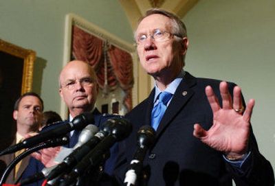 
Senate Minority Leader Harry Reid of Nev., right, and CIA director nominee Gen. Michael Hayden, appear at a news conference Friday. Hayden oversaw a controversial NSA database program. 
 (Associated Press / The Spokesman-Review)