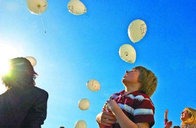 
Northwest Christian student Tallon Olson watches his message to Jesus written on a balloon float into the sky on Thursday. Students participated in events marking the Stations of the Cross. 
 (Christopher Anderson / The Spokesman-Review)