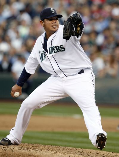 Seattle Mariners pitcher Felix Hernandez throws in the sixth inning against the Yankees on Tuesday.  Hernandez picked up his ninth win of the season as the M's defeated New York 4-2. (Associated Press)