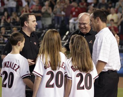 Luis Gonzalez, right, will take on a front-office role for Arizona, the team he led to a World Series title in 2001. (Associated Press / The Spokesman-Review)