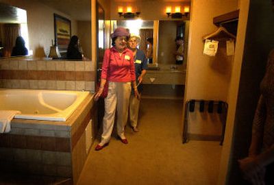
Marie Romain, left, and Dorothy Graham check out the master bedroom with a Jacuzzi tub in a fourth-floor suite at the Best Western Pheasant Hill. On Wednesday Best Western celebrated its 60th birthday and renovation with an open house.
 (Liz Kishimoto / The Spokesman-Review)
