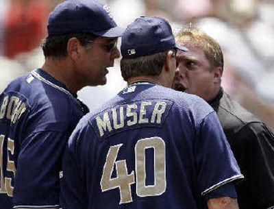 
Umpire Bruce Dreckman and Padres' coach Tony Muser engaged in a heated debate in the sixth inning. Four were ejected from the game against Atlanta including Muser and both managers.
 (Associated Press / The Spokesman-Review)
