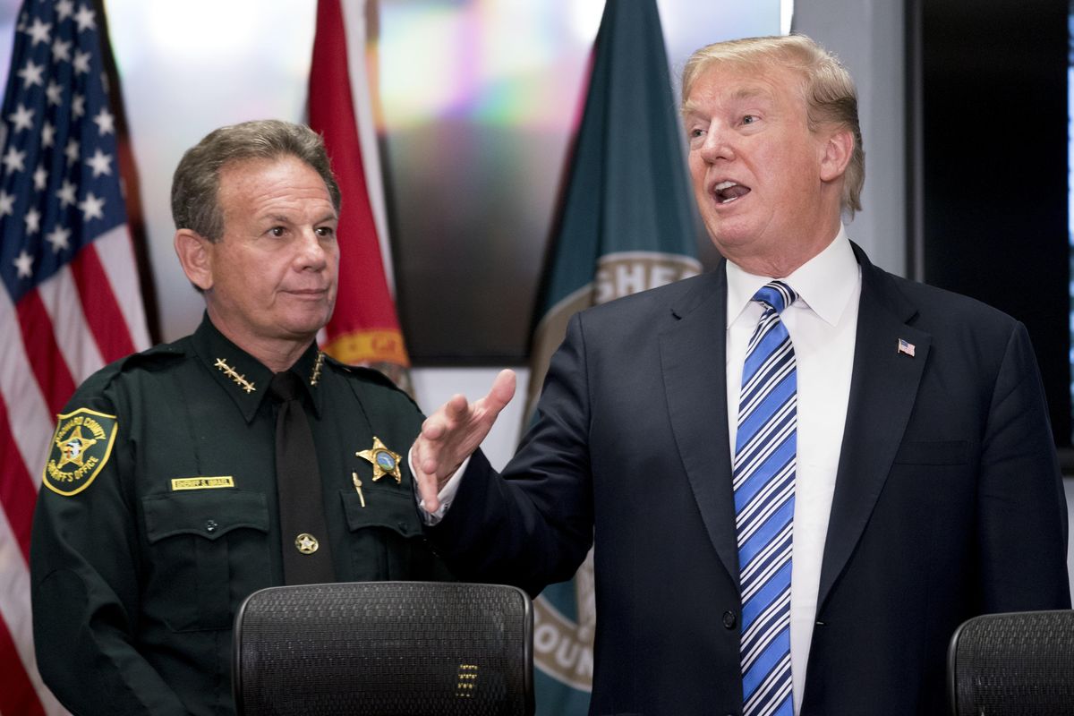 President Donald Trump, accompanied by Broward County Sheriff Scott Israel, left, speaks to law enforcement officers at Broward County Sheriff’s Office in Pompano Beach, Fla., Friday, Feb. 16, 2018, following Wednesday’s shooting at Marjory Stoneman Douglas High School, in Parkland, Fla. (Andrew Harnik / AP)