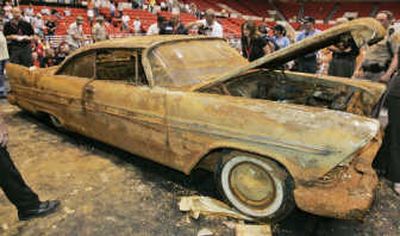 
A 1957 Plymouth Belvedere buried 50 years ago near the Tulsa, Okla., courthouse was dug up looking worse for wear Friday. Associated Press
 (Associated Press / The Spokesman-Review)