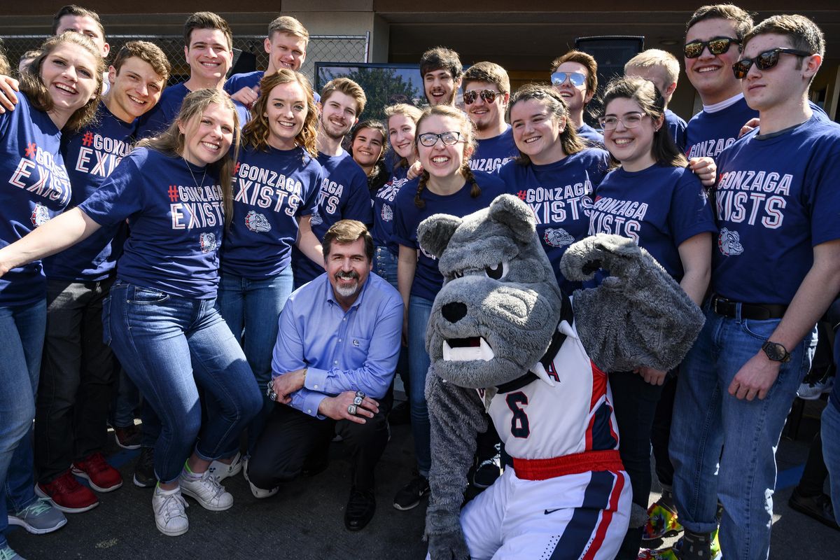 Gonzaga President Thayne McCulloh joins band members and mascot Spike for a photo Thursday, March 28, 2019, during a pre-game social in Anaheim, Calif. (Colin Mulvany / The Spokesman-Review)