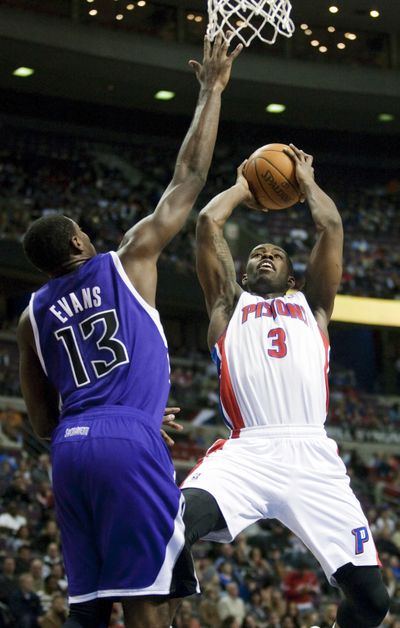 Pistons’ Rodney Stuckey, right, shoots over Kings’ Tyreke Evans. (Associated Press)