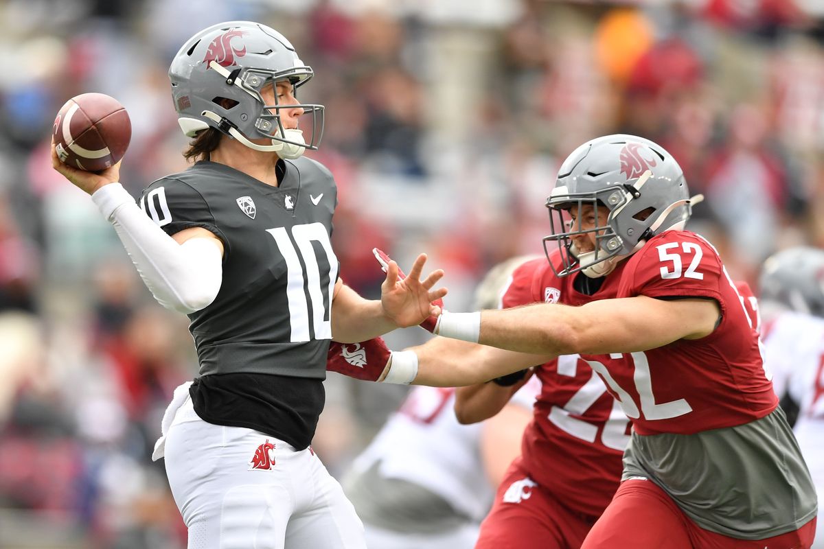 Washington State Cougars quarterback John Mateer (10) throws as linebacker Kyle Thornton (52) sacks him during WSU’s Crimson and Gray spring football game on Saturday, Apr. 27, 2024, at Gesa Field in Pullman, Wash.  (Tyler Tjomsland/The Spokesman-Review)