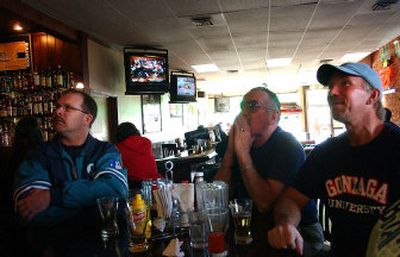 
 Dean Buchman, left, and Marv and Mike Plaggerman watch the pairings at Jack and Dan's. 
 (Liz Kishimoto / The Spokesman-Review)