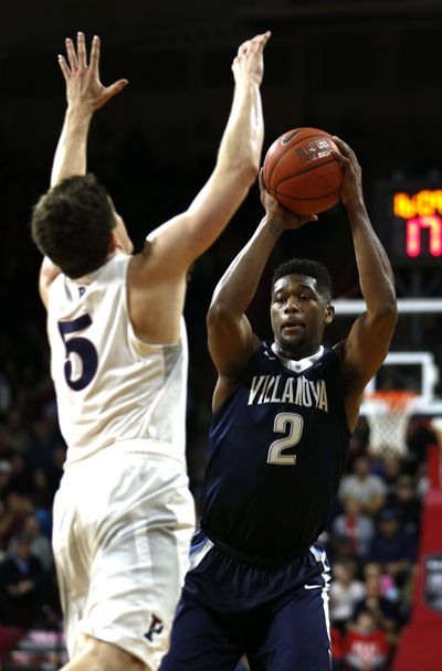 Villanova forward Kris Jenkins, right, moves around Pennsylvania guard Jackson Donahue in the first half of an NCAA college basketball game, Tuesday, Nov. 29, 2016, in Philadelphia. (Laurence Kesterson / Associated Press)