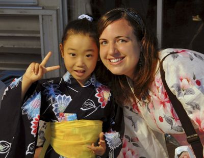 In this photo provided by her family, Taylor Anderson poses with one of her students in Ishinomaki, Japan. (Associated Press)