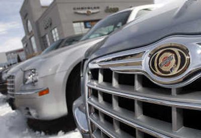
Unsold 2007 Chrysler 300 sedans sit at a dealership in Centennial, Colo., on Sunday.  Chrysler LLC plans to significantly reduce its product lineup and number of dealerships as the automaker rolls out a new corporate initiative. Associated Press
 (Associated Press / The Spokesman-Review)
