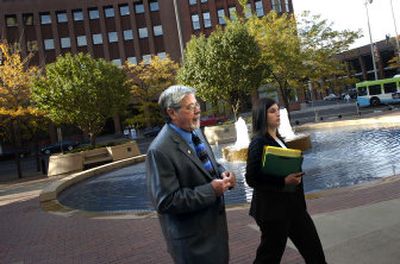 
Former Airway Heights Mayor Dale R. Perry, left, and Assistant Federal Defender Amy Rubin walk toward the entrance of the fderal courthouse in Spokane on Tuesday morning. 
 (Holly Pickett / The Spokesman-Review)