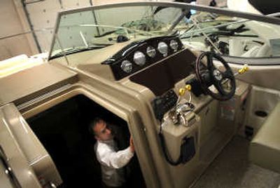 Doug Trudeau checks out one of his company's boats in storage at Trudeau's Marina in Spokane. Trudeau said he's trying to keep up with demand from customers who are eager to get their boats in the water.
(Rajah Bose / The Spokesman-Review)