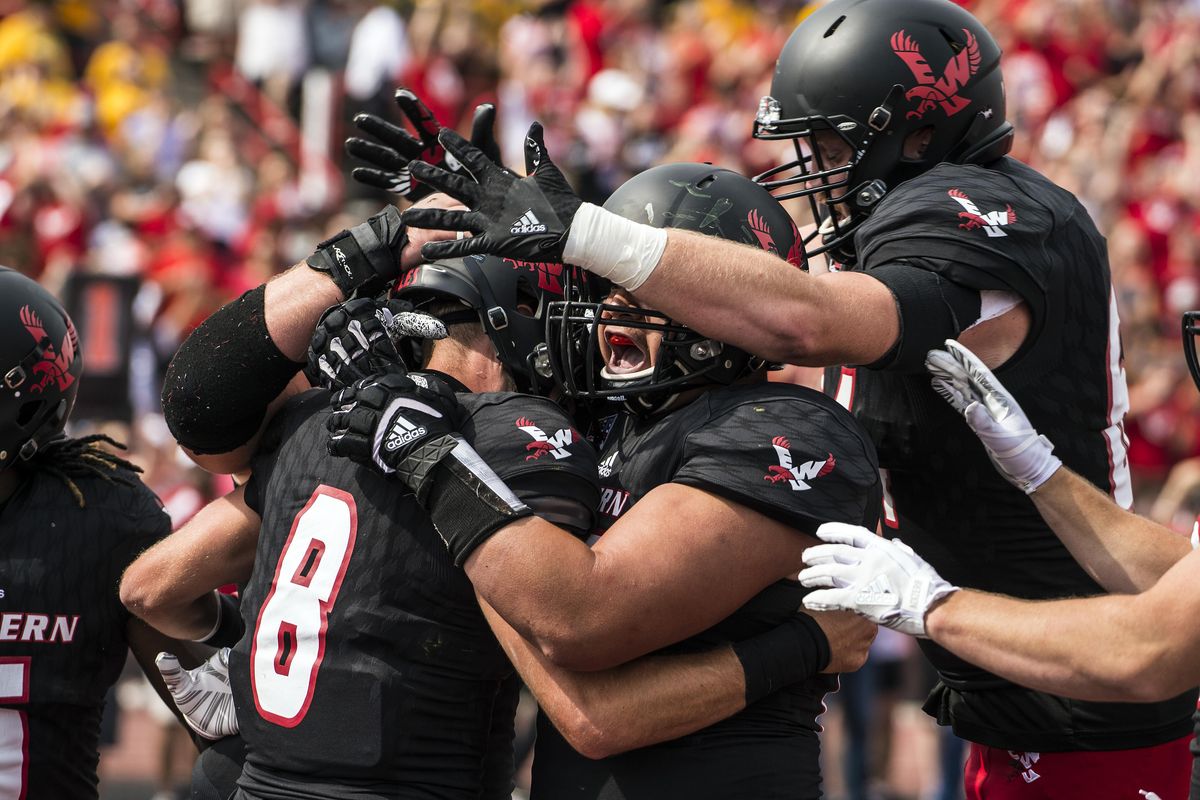 Eastern Washington quarterback Gage Gubrud (8) is swarmed by players after he scored the Eagles first touchdown against North Dakota State in the First quarter i Cheney, Sat., Sept. 9, 2017. (Colin Mulvany / The Spokesman-Review)