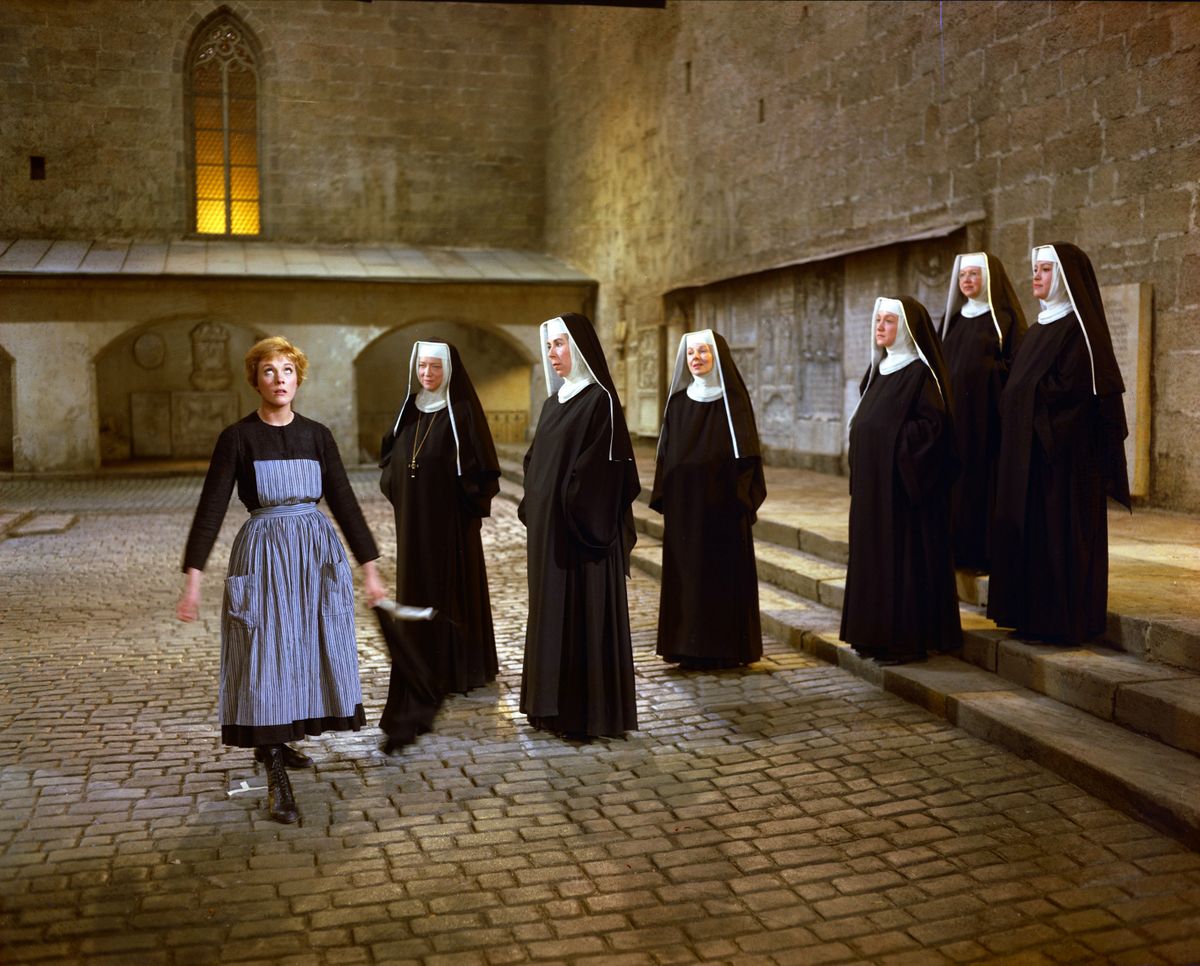 Julie Andrews, left, as Maria, and a group of nuns, in a scene during the song “Maria” from the film “The Sound of Music.”