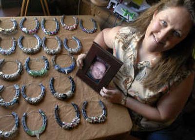 
Kimi Corbin started decorating horseshoes with her stepson when he was in the hospital with leukemia. Now she sells the pieces in his honor.
 (Holly Pickett / The Spokesman-Review)