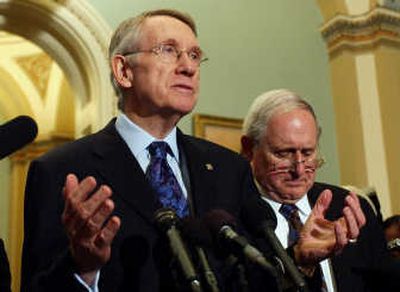 
Senate Majority Leader Harry Reid, of Nevada, accompanied by Sen. Carl Levin, D-Mich., talks to reporters Wednesday in Washington  after a vote on a change to the Defense Authorization Bill. Associated Press
 (Associated Press / The Spokesman-Review)