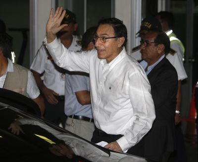 Peru’s first Vice President Martin Vizcarra waves to supporters after arriving at Jorge Chavez International Airport in Lima, Peru, Friday, March 23, 2018. (Karel Navarro / Associated Press)