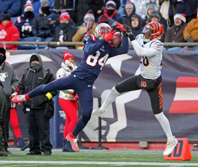 New England Patriots wide receiver Kendrick Bourne tries to haul in a pass in front of Cincinnati Bengals cornerback Eli Apple on Saturday in Foxboro, MA.  (Boston Herald)