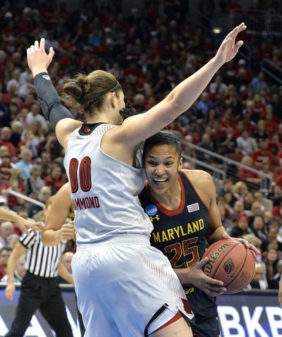 Maryland’s Alyssa Thomas attempts to duck under the defense of Louisville’s Sara Hammond on Tuesday. (Associated Press)