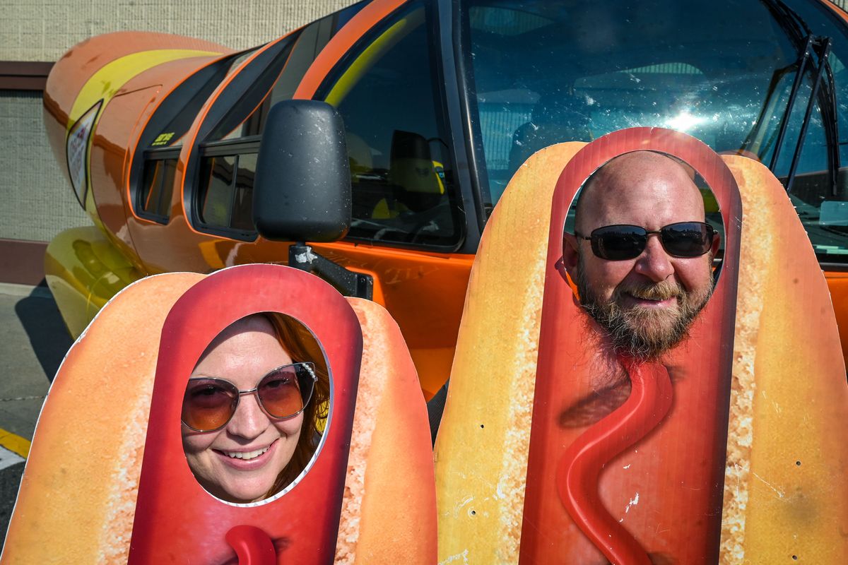 Amber and Anton Fox get all dogged-up as they pose for pictures with the Oscar Mayer Wienermoblie outside the Rosauer