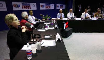 
From left, Sen. Hillary Rodham Clinton, D-N.Y., former Alaska Sen. Mike Gravel, Sen. Barack Obama, D-Ill., and other Democratic presidential hopefuls  wait for the start of the National Public Radio debate Tuesday in Des Moines, Iowa. Associated Press
 (Associated Press / The Spokesman-Review)