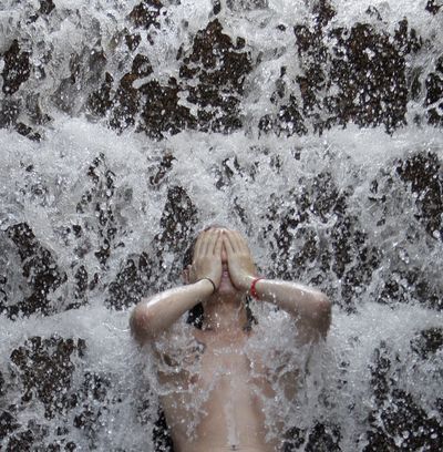 Timothy Byars, 23,  cools off in a fountain in Portland on Tuesday.  (Associated Press / The Spokesman-Review)