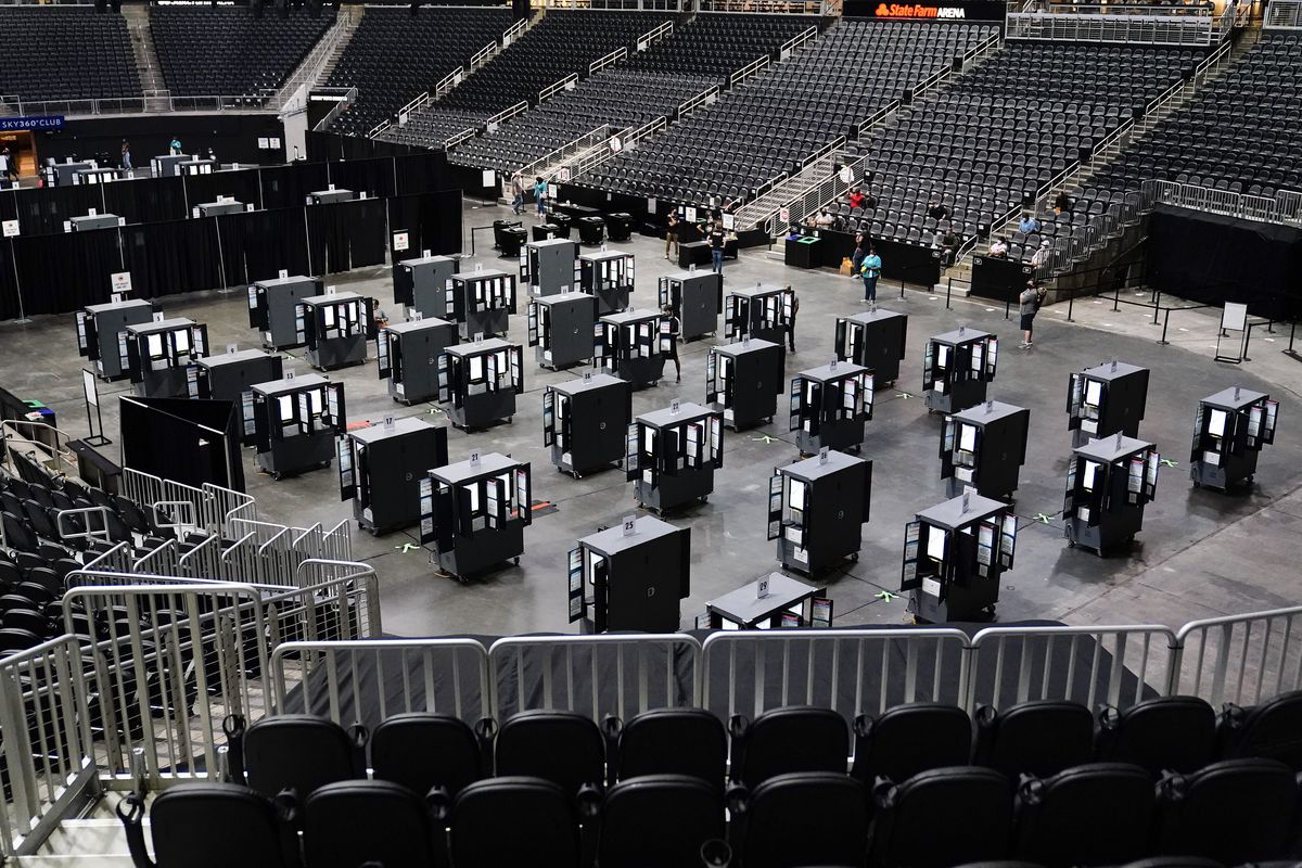 Voting machines fill the floor for early voting at the State Farm Arena in Atlanta on Oct. 12. A record-setting 108 million people voted before Election Day, either through early in-person voting or by mailing or dropping off absentee ballots – that represents nearly 70% of all votes cast.  (Brynn Anderson)
