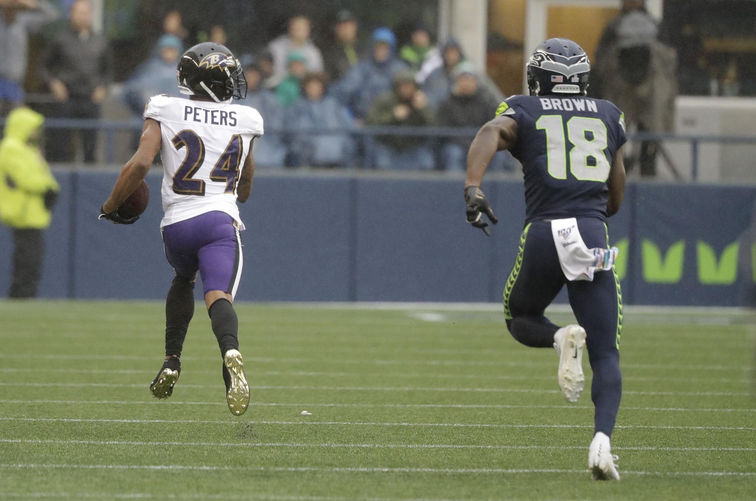 Baltimore Ravens quarterback Lamar Jackson, center leaps up after scoring a  touchdown during the second half of an NFL football game against the  Seattle Seahawks, Sunday, Oct. 20, 2019, in Seattle. (AP