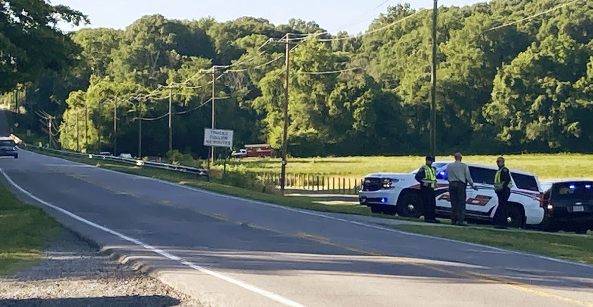 Rockingham County Sheriff Sam Page waits with other officials for the arrival of the State Highway Patrol