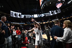 Gonzaga Bulldogs guard Davis Fogle (4) reacts as he comes off the floor to cheers from fans after defeating the Kennesaw State Owls during the second half of the first round of the NCAA basketball tournament on Thursday, Mar 19, 2026, at Moda Center in Portland, Ore. The Gonzaga Bulldogs won the game 73-64. (Tyler Tjomsland/The Spokesman-Review)