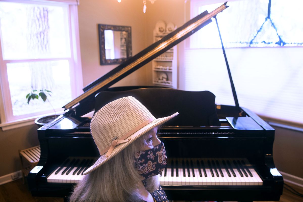 Pianist Patsy Pinch plays a song every day and posts it on Facebook. She’s been doing this for more than 300 days. She started the postings because she could no longer volunteer her time to play the piano at Providence Sacred Heart Medical Center. She is photographed Dec. 29 at her home in Spokane.  (Kathy Plonka/The Spokesman-Review)