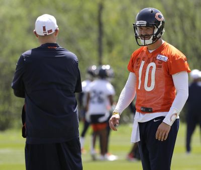 In this May 22, 2019 photo, Chicago Bears quarterback Mitchell Trubisky, right, smiles as he talks with head coach Matt Nagy during NFL football practice in Lake Forest, Ill. Trubisky is facing some lofty expectations. Bigger things are expected in his second season under coach Matt Nagy and with the Chicago Bears winning the NFC North to reach the playoffs for the first time in eight years. (Nam Y. Huh / Associated Press)