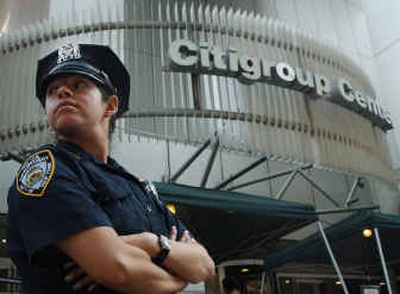 
 A New York City Police officer guards the Citigroup Center in New York three weeks after the building was identified as a potential terrorist target on Aug. 20. 
 (File/Associated Press / The Spokesman-Review)