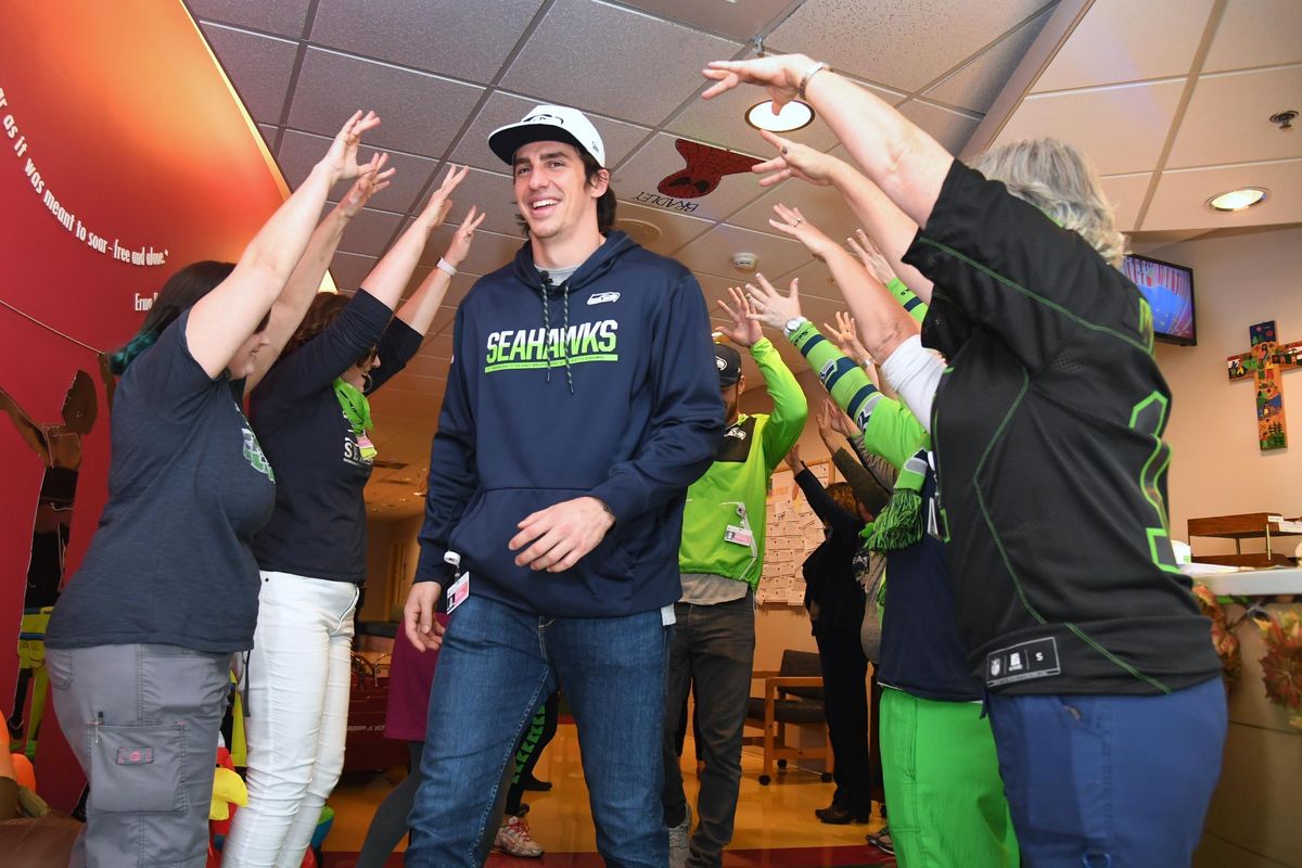 Seattle Seahawks players visit children at Sacred Heart