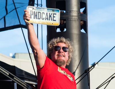 Sammy Hagar displays a personalized license plate as the band breaks into the Van Halen song “Poundcake,