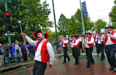 
Brandon Scalf of the Seattle-based Rainbow City Band marches along Spokane Falls Boulevard during the Pride Parade last year.
 (File / The Spokesman-Review)