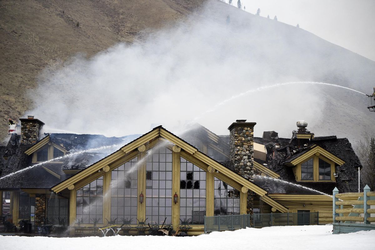 Firefighters work to extinguish a blaze that heavily damaged the Warm Springs Lodge on Thursday, April 19, 2018, after a fire broke out at the famed lodge at the base of one of the nation’s premier ski destinations in Sun Valley, Idaho. (Jason Kindred / Idaho Mountain Express)